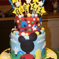 Micky's Clubhouse This is a cake I did for a friend's daughter, who is a big fan of the Micky Mouse club. It is three tiers, two 8" tiers, and one...