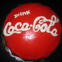 Coca Cola My niece wanted a coke bottle cap cake for her 14th birthday. It did not turn out like i hoped but she loved it! ;)