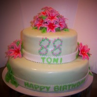 88 Th Birthday Cake GUM PASTE STAR GAZER LILLIES ON FONDANT COVERED CAKE.