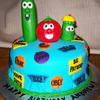 Veggietales Birthday Cake This is a yellow cake covered in fondant. I really couldnt think of a scene for the veggietales to be in so I went simple. I put them on a...