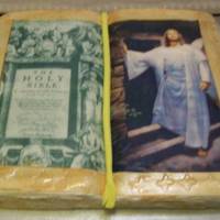 Holy Bible Cake This is a yellow cake. It is in 3D made to look like the Holy Bible. One side is the initial page in the bible and the other side is Christ...