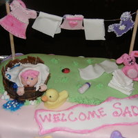 Welcome Sadie Baby Shower Cake I made this cake for a baby shower. The cake is done in gum paste, fondant, and chocolate. For the babie's tub, I make a chocolate...