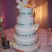 Wedding Cakes 4 Tier Round wedding cake with lyrics around each tier. Gumpaste/Fondant Calla lilies