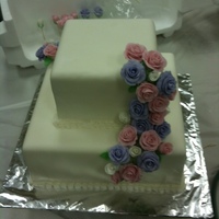 Course 3 Final Cake. Course 3 final cake. Covered in fondant with fondant roses. Buttercream shell border.