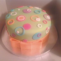 Circles And Circles This was a small bday cake for a 10 year old. She loved it, but it was my first fondant covered cake! Had to put the bow around the bottom...