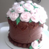 Roses This is a chocolate cake with bavarian creme filling and homemade chocolate frosting, topped with buttercream roses.
