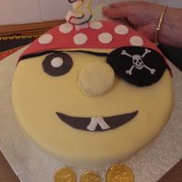 Pirate Cake I made this for my Daughters 3rd birthday. I made the bandanna pink so it was a bit more girlie. The eye patch is a real eye patch and the...