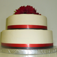 White And Red With Gerbers 8 & 10" lemon cake with raspberry BC. Red and black ribbon borders. TFL!