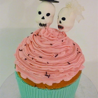 Giant Cupcake Cake The bride and groom were VERY specific about this cake! If I remember correctly, it was 3 6" cakes stacked with a mini ball pan on top...