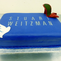 Stuart Weitzman Shoebox Two 9x13 red velvet cakes stacked. Covered in fondant and the teeny tiny shoe is gumpaste. I printed the logo and cut out the lettering...