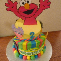 Elmo Cake This cake was for my son's 2nd birthday. It was all chocolate, 8" and 6" topsy turvy tiers. Sesame street characters are all...
