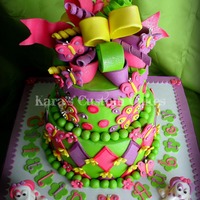 Icing Smiles- Puppy Dogs And Butterflies This was my 4th cake for Icing Smiles. It was for two sisters who were celebrating their birthdays this month. They recently lost their big...