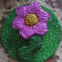 Flower Cupcake Cake Choc. chip creamcheese filled cupcakes shaped like a flower with BC frosting. I added "Happy Birthday" to stem and name in the...
