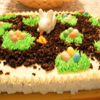 Easter Egg Hunt Made this cake for easter, fondant bunny nibbling on some carrots made from starburst candy, eggs, are jelly beans, rest is cream cheese...