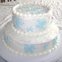 Snowflake My husband and I got married at Christmas 2 1/2 years ago. We had a winter wonderland theme. Since I just took my cake decorating class I...