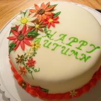 Autumn Daisies This is my first cake! It is a carrort cake with cream cheese icing. The cake is covered in fondant with fondant daisies and cream cheese...