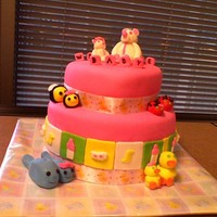 Mamaswith Baby Girls Cake Another baby shower cake for the friend of a coworker. 9" round with 6" round. Fondant decos.