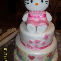 Baby Hailey's Kello Kitty Cake 12" chocolate w/ vanilla buttercream, 10" marble w/ choco buttercream, 8" butter cake w/ coconut buttercream and pineapple...