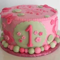 1St Birthday Smash Cake Cherry cake with buttercream icing and fondant accents.