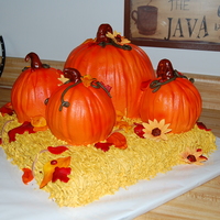 Fall Theme Wedding 100% edible...pumpkins & hay are buttercream, everything else is Caramel Creme MMF. The pumpkins are pumpkin spice cake & the...