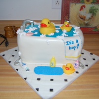 Rubber Duck Baby Shower All edible, except for the ducks. Half chocolate fudge cake w/ homemade chocolate whipped cream filling. Other half is french vanilla cake...