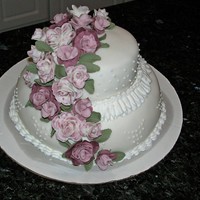 Wedding Cake Fondant covered buttercream yellow and chocolate cake.