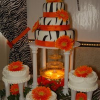 Quinceanera Cake 3 tier zebra print cake covered w/fondant 3 additional cakes are iced w/buttercream.