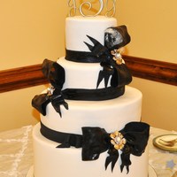 Big Black Bows This was a custom wedding cake for a bride who loved bows. Forgot to take the plastic out of the top bow loop before I took this pic (oops...