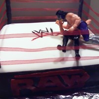 Wwe Raw Covered with fondant. The wrestler's arefigures I picked up from the store.