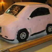 Pink Cadillac Srx This was my first attempt EVER at a 3-D cake. It gave me a lot of trouble, but the client was very pleased w/ it. I learned a lot also!