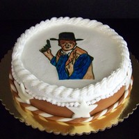 John Wayne Cake I did this cake for my uncle who will be 69, he loves John Wayne. Chocolate cake with bav. cream filling and buttercream frosting with MMF...