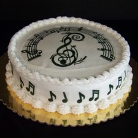 Music Note Cake Red Velvet cake with cream cheese filling, butter cream frosting. Decorations done on rice paper with edible markers. TFL