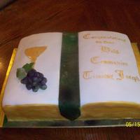 Communion Cake This is a 2 layer WASC cake with italian buttercream covered in fondant with fondant chalice and marzipan grapes. It was my first ime...