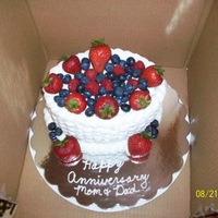 Anniversary Cake This was a lemon cake with raspberry filling covered in vanilla bc basketweave and fresh berries. Forgot to take a picture until the very...