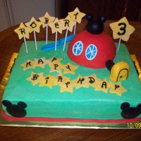 Mickey Clubhouse Cake This was for a friend's little boy. Cake is chocolate with bavarian cream filling, bc. Clubhouse is poundcake covered in fondant....