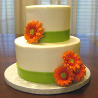 Wedding Cake With Gerbera Sugar Flowers I made about a dozen of these flowers but only ended up using 4! The cake is chocolate with fresh raspberry layers topped with raspberry...