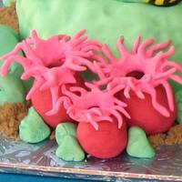 Ocean I made this cake for my daughter's swim team banquet. Dolphins & some of the coral are RKT covered in gumpaste/fondant. White cake...