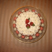 Strawberries `n Cream! Simple but very yummy vanilla cake with fresh strawberries and whipped cream!Around the cake are cake truffles.Delish but time consuming...