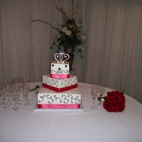 Wedding Cake Wedding cake for my best freind's son and his bride. Multi-flavors throughout the cake. Butter Cream icing with colorflow dots and...