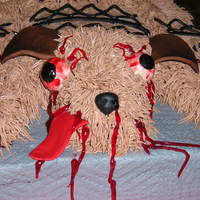 Road Kill Cake This cake was for a "Road Kill" party for my cousin. It's red velvent cake with butter cream icing and the eyes, ears,...