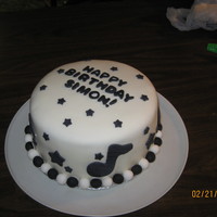 Birthday Cake With Music Notes And Stars My fiancee and I made this for our friend's birthday. MMF with gumpaste stars, music notes, ball border and name. Cake is devils food...