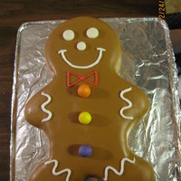 Gingerbread Man Cake Gingerbread man for Christmas. Covered with MMF, decorations are made with gumpaste and face is royal icing. Cake is pound cake from...