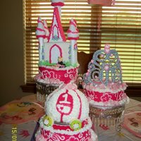My Daughter's First Birthday Cake This is the photo of my daughter's first birthday cake. The top tier has the castle with the little princess made of fondant. I made...