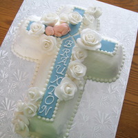 Brauxtons Baptism One of the final cakes for my only grandchild's baptism. Buttercream icing and fondant roses. The baby is also made of fondant.