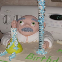 Mad Scientist Cake The beaker and flask had tubes hidden in them so a little water and dry ice could be added to make "fog" at service time.