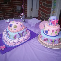 Rasberry Swirl baby shower buttercream with fondant accents. to match nursery design lambs and ivy rasberry swirl. one cake chocolate one yellow per mama...