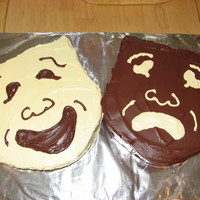 Comedy Tragedy Masks Handcarved cakes covered with buttercream, made for a friend's son who is active in the theater