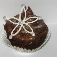 Delicate Flower Cupcake For this cupcake I used a chocolate cake with cream cheese filling and chocolate cream cheese frosting. I was going for a modern twist on a...