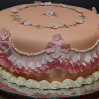 Girly Cake Made this 8" white chocolate layer cake to celebrate the arrival of my baby niece. Filled with buttercream and covered by peach...