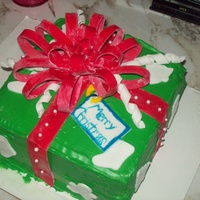 Christmas Present Cake All edibal, ribbons and bows are fondant, this cake was for a Christmas part, Lemon and Red Velvet cakes with lemon/butter cream filling.